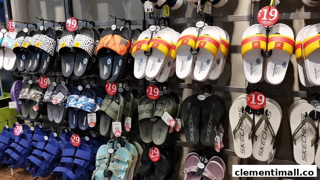 A vibrant display of Skechers sandals and flip-flops in various styles and colors, some with price tags.