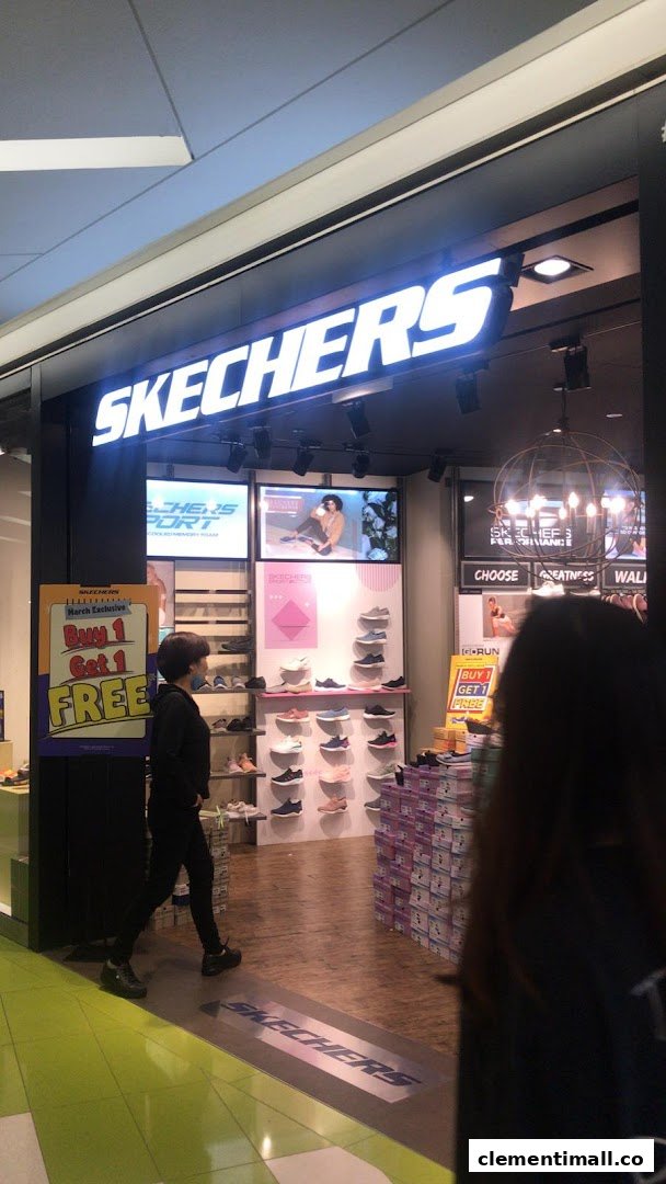 The Skechers store entrance features a bright logo, shoe displays, and a 'Buy 1 Get 1 FREE' promotion.