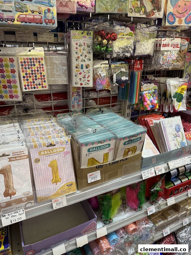 Shelves stocked with party supplies, balloons, and craft items at SKP Clementi Mall.