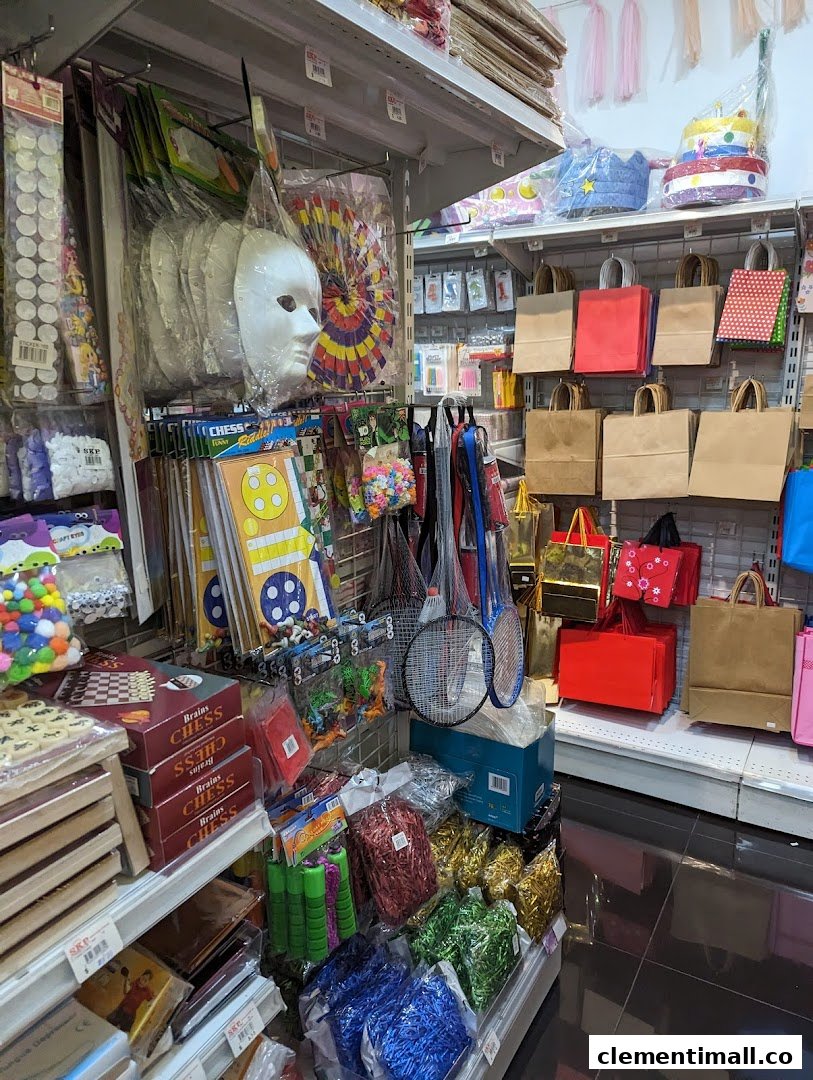 Shelves filled with party supplies, craft items, games, and gift bags in a retail store.