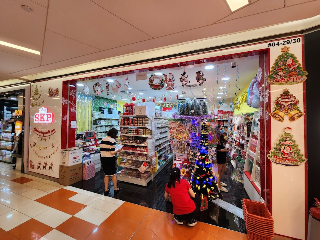 The shop front of SKP, decorated with festive Christmas items and featuring customers browsing inside.