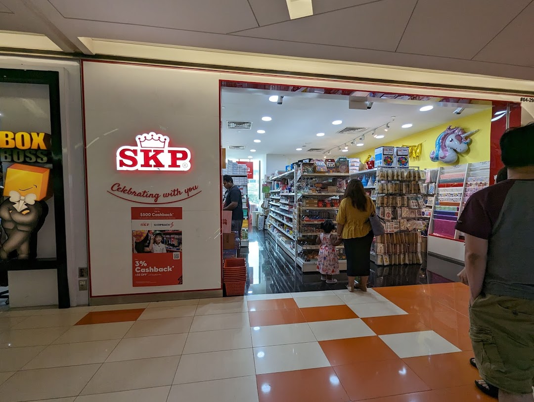 The brightly lit entrance of SKP, a retail shop, with customers browsing inside.