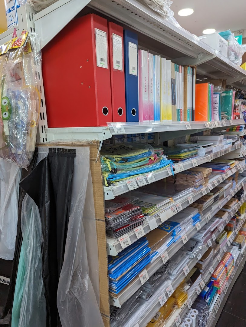 Shelves filled with a wide array of colorful stationery, binders, and office supplies at SKP.