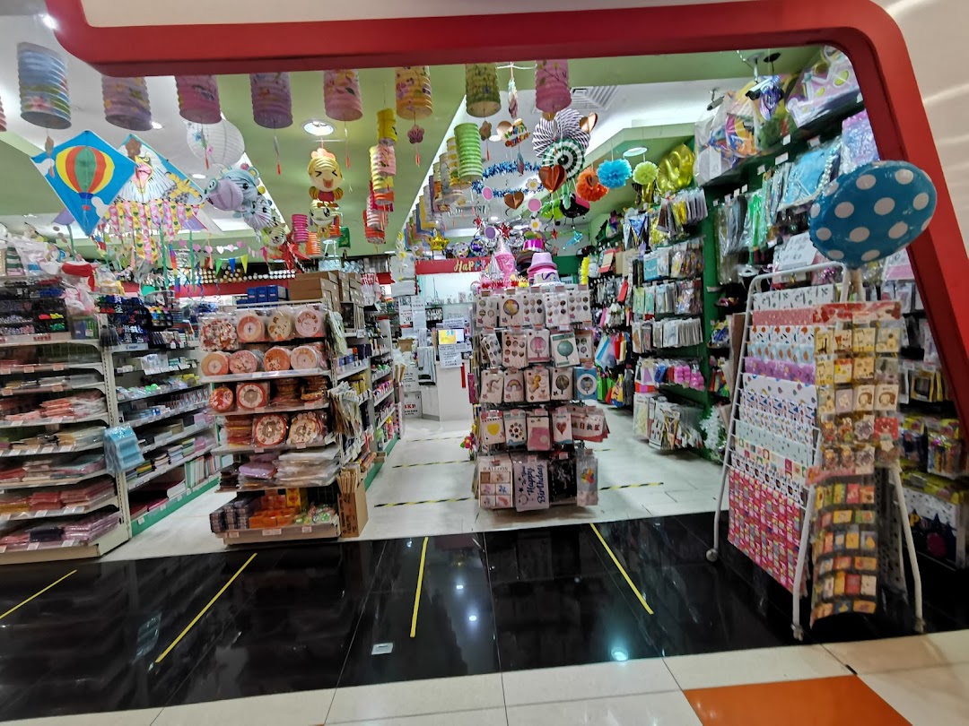 A vibrant interior view of SKP, showcasing a wide array of party supplies, stationery, and decorative items.