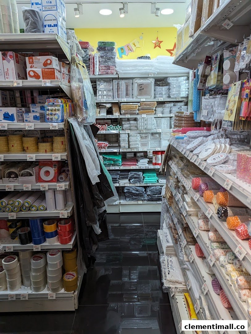 Aisle view inside SKP Clementi Mall, showcasing shelves stocked with various craft, baking, and packaging supplies.