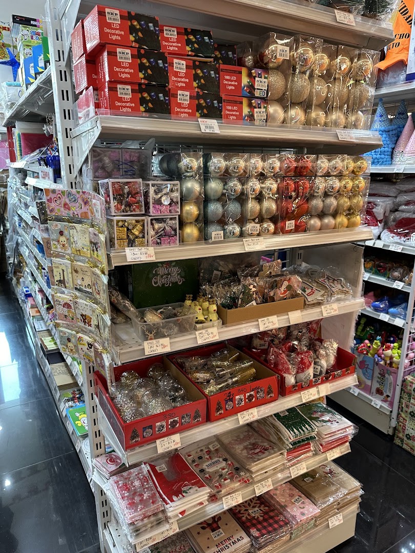 Shelves filled with a variety of festive decorations, including LED lights, ornaments, and party supplies.