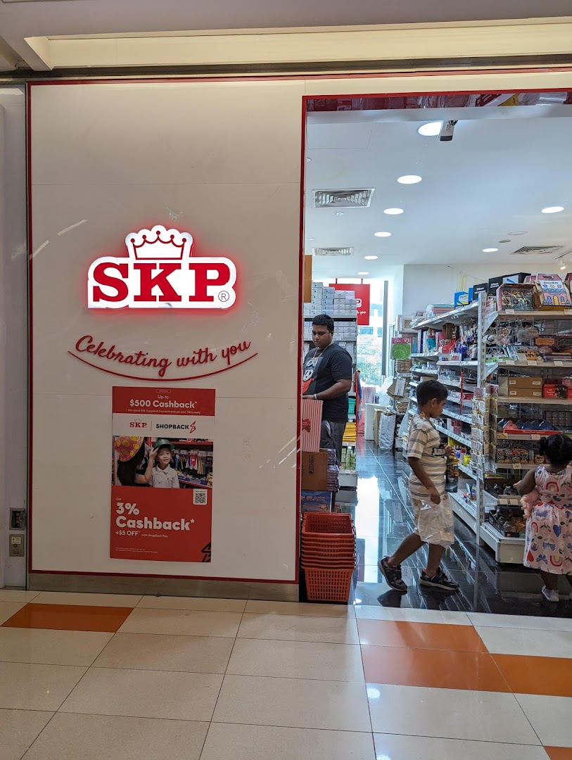 The bright red SKP logo illuminates the shop entrance, inviting customers into a store filled with various goods.