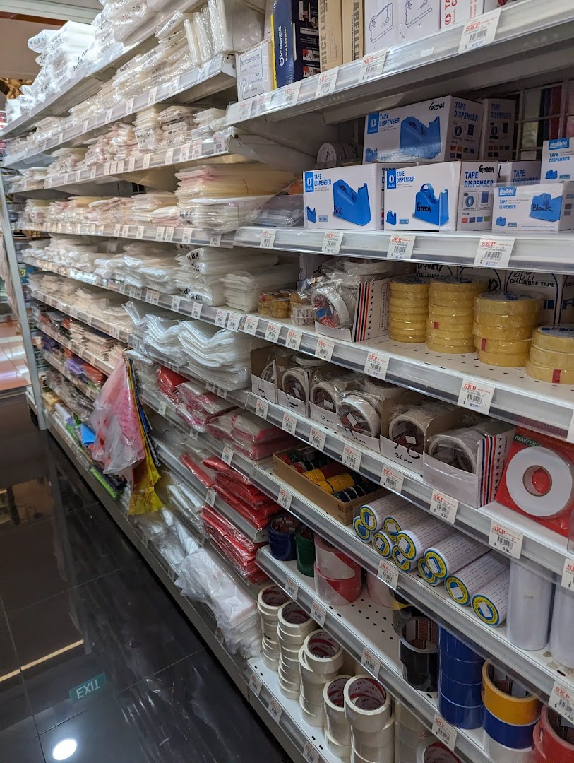 An aisle in SKP Clementi Mall displaying a wide range of packaging materials, tapes, and stationery supplies.