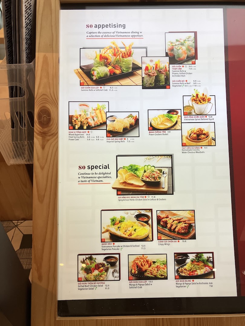A detailed menu board showcasing a variety of Vietnamese appetizers and specialties with images and prices.
