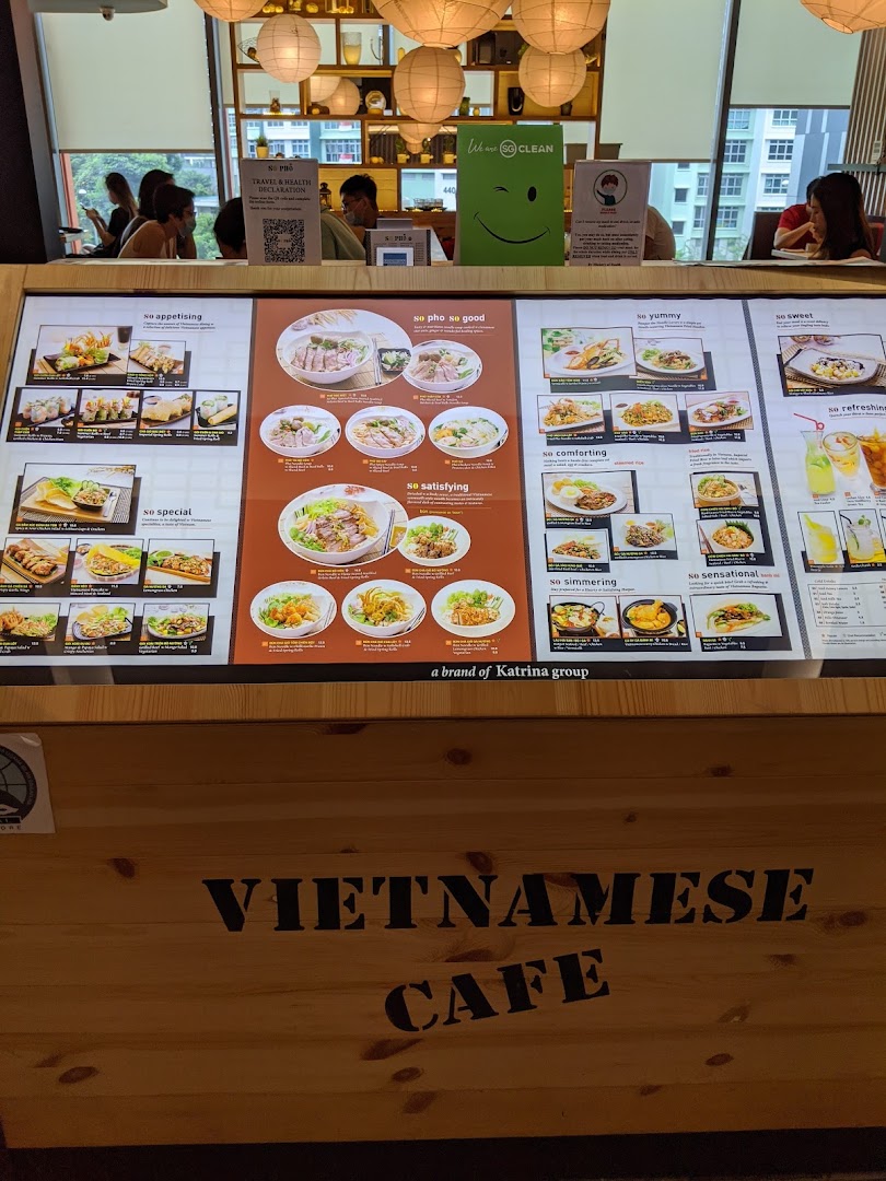 A large illuminated menu board showcasing various Vietnamese dishes and drinks at So Pho.