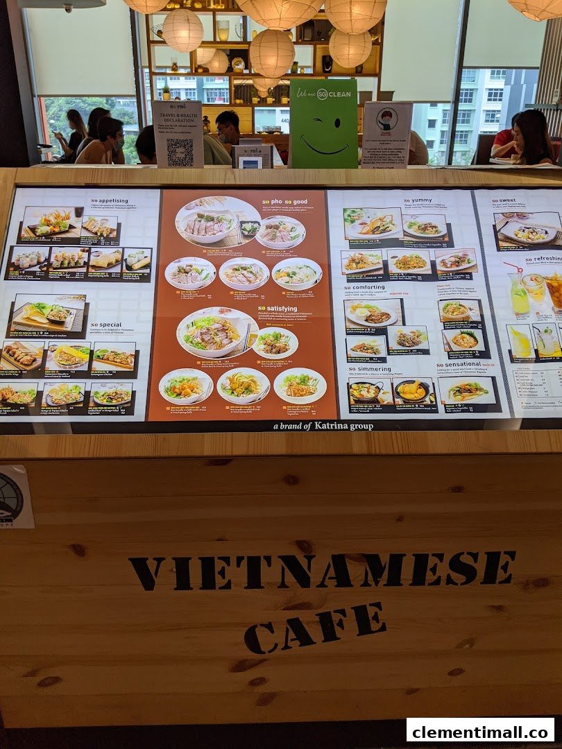 A large illuminated menu board showcasing various Vietnamese dishes and drinks at So Pho.