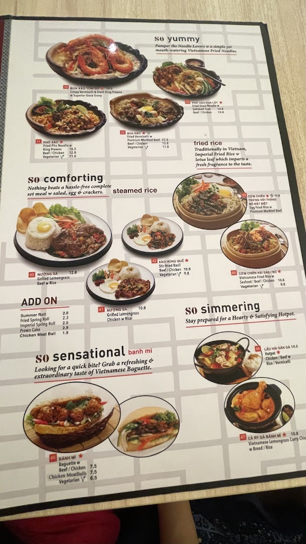 A detailed menu displaying various Vietnamese dishes, including noodles, rice, set meals, and banh mi.