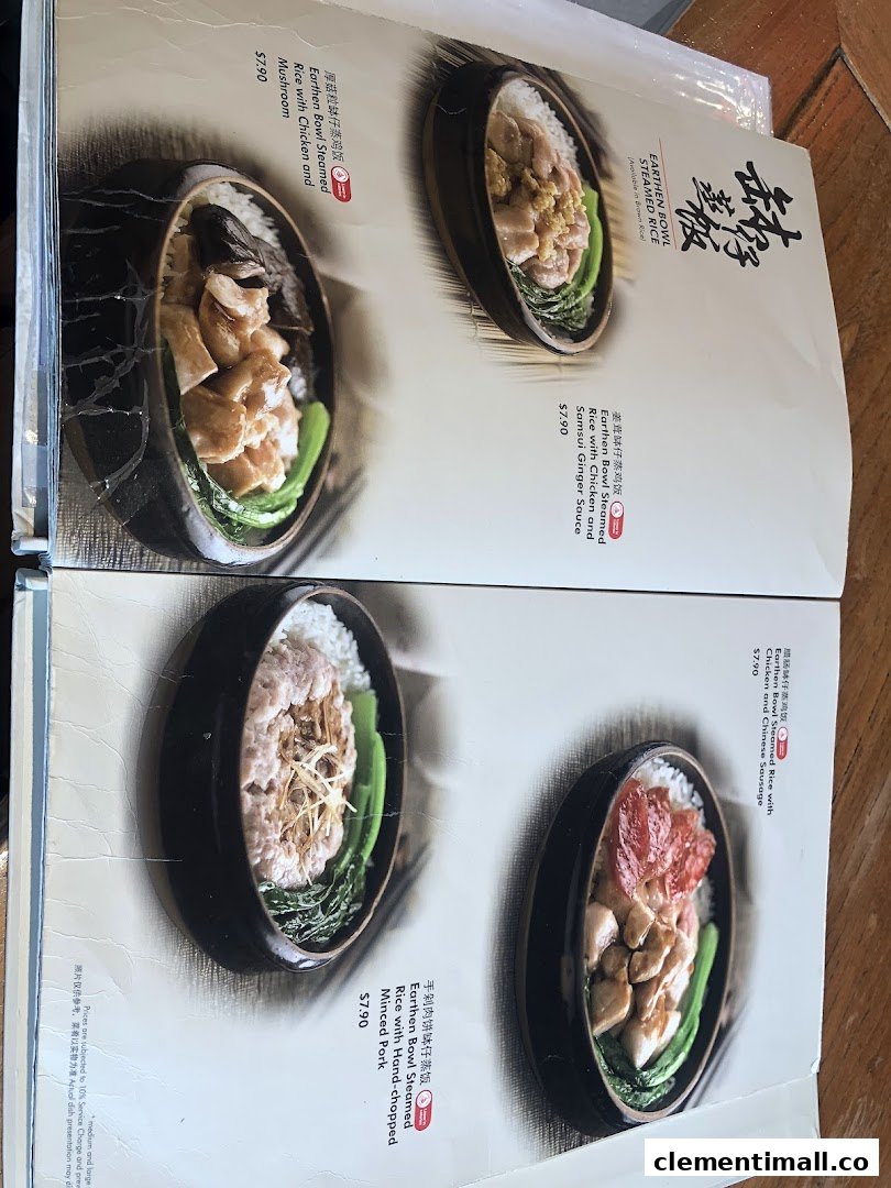 A menu page showcasing various Earthen Bowl Steamed Rice dishes with ingredients and prices.