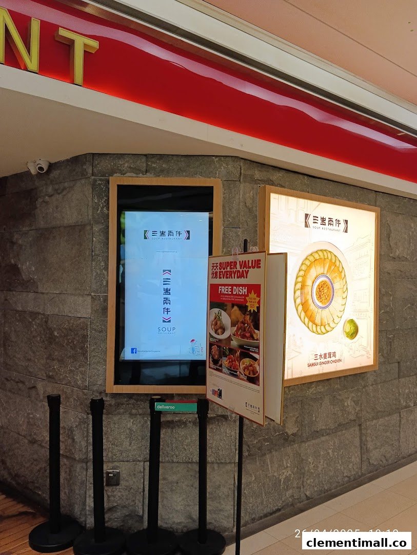 Exterior view of Soup Restaurant with promotional displays and digital screen.