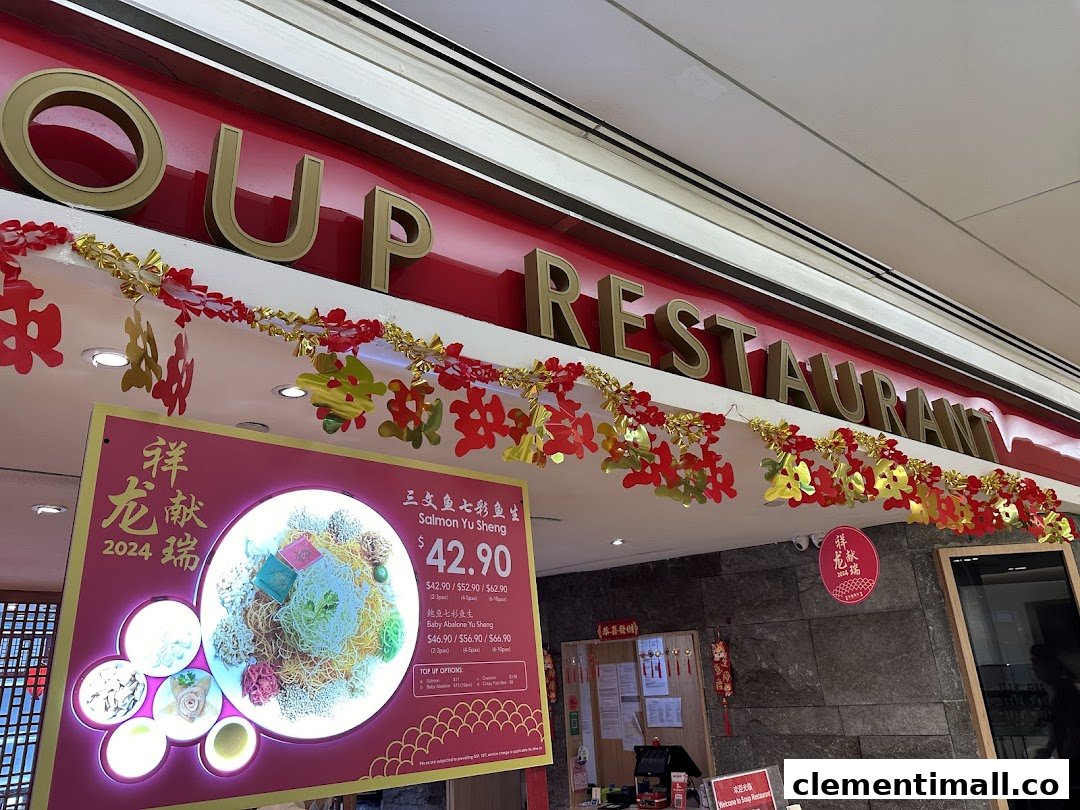 The Soup Restaurant shop front adorned with festive decorations and a Yu Sheng promotional display.