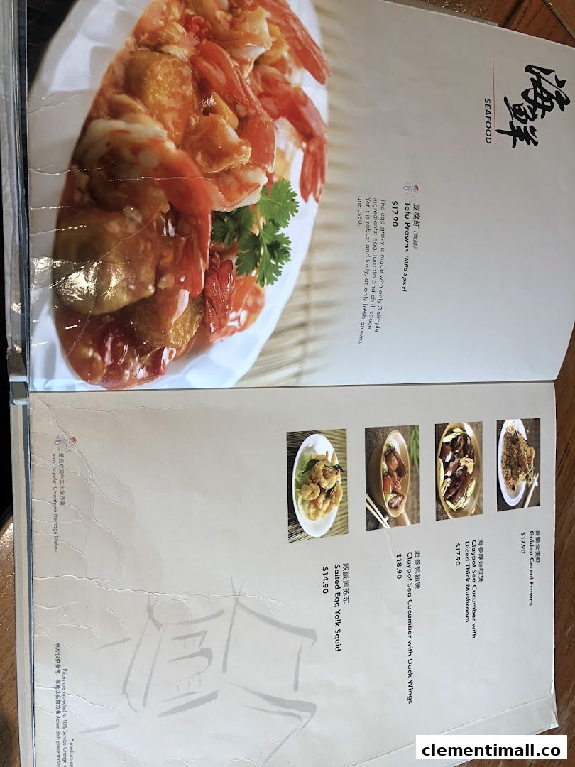 A menu page showcasing various seafood dishes with descriptions and prices, including Tofu Prawns and Salted Egg Yolk Squid.