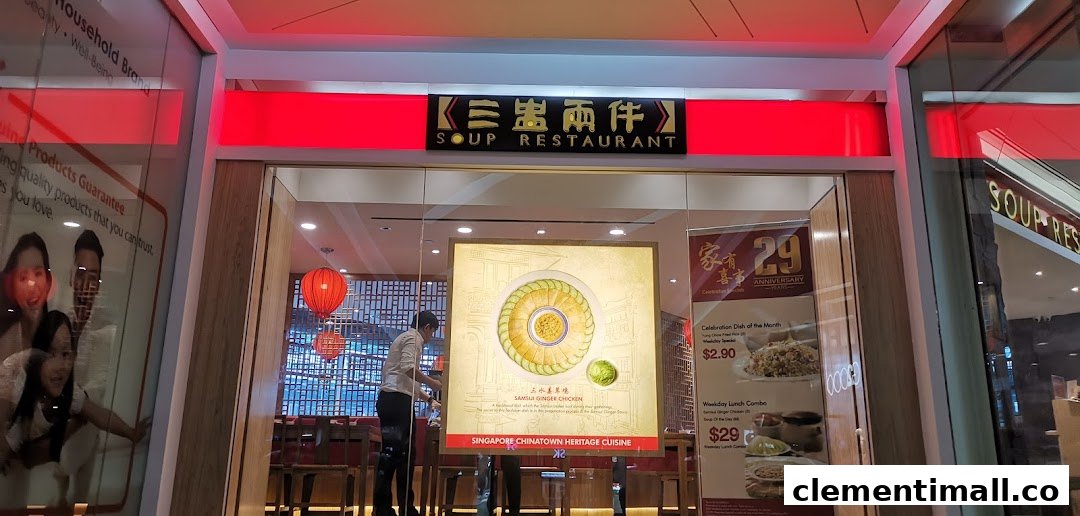 The illuminated entrance of Soup Restaurant, showcasing its signboard and promotional displays.