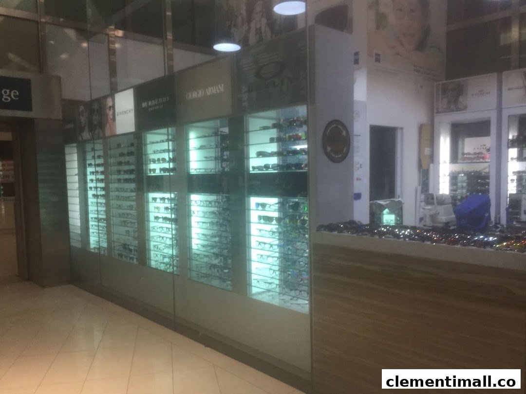 The front of Spectacle Hut, an optical shop, showcasing various eyewear in illuminated display cases.