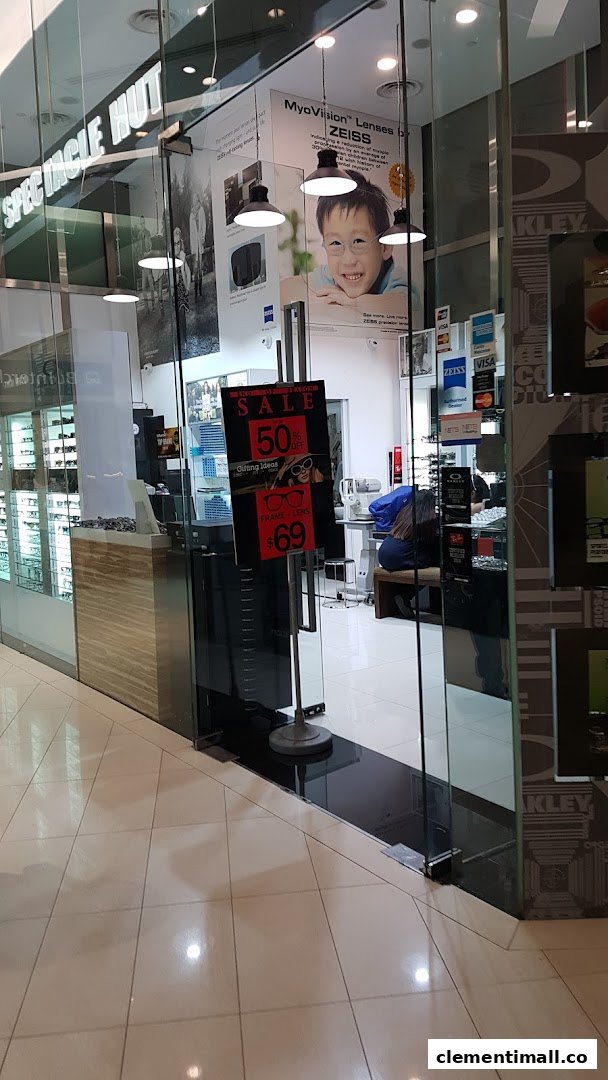 The glass entrance of Spectacle Hut, showcasing eyewear displays and promotional offers on frames and lenses.