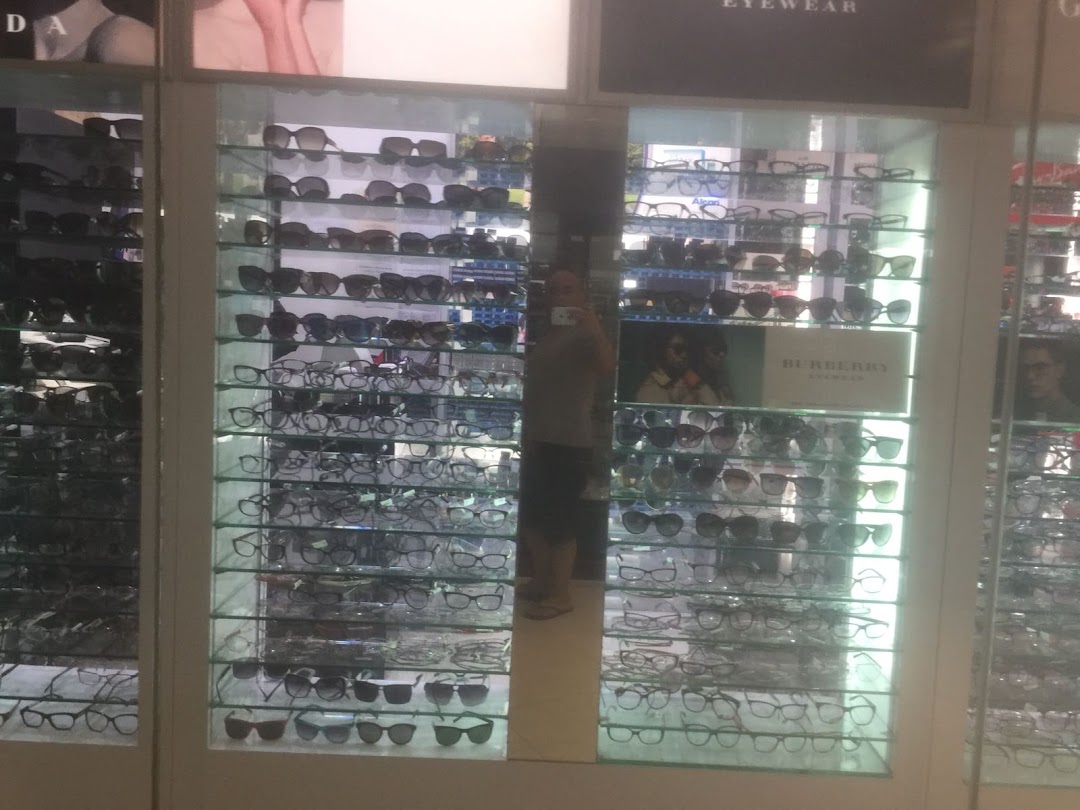 An interior view of Spectacle Hut, showcasing a wide selection of eyeglasses and sunglasses on display shelves.