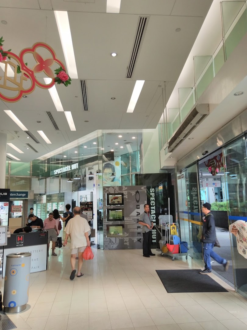 The bustling entrance of Spectacle Hut at The Clementi Mall, featuring eyewear displays.