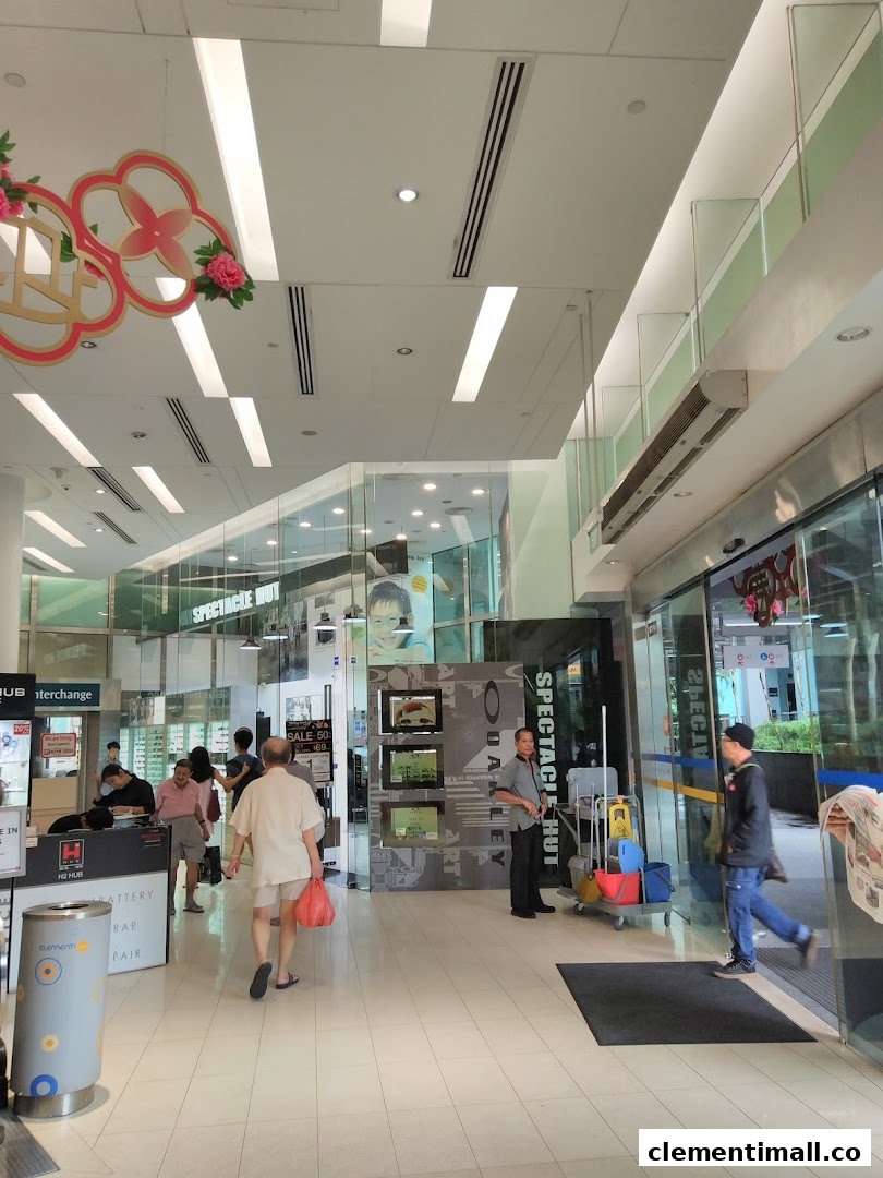 The bustling entrance of Spectacle Hut at The Clementi Mall, featuring eyewear displays.