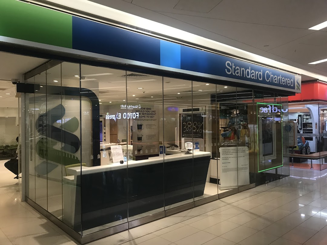 Exterior view of Standard Chartered Bank at The Clementi Mall, showcasing its modern glass facade.