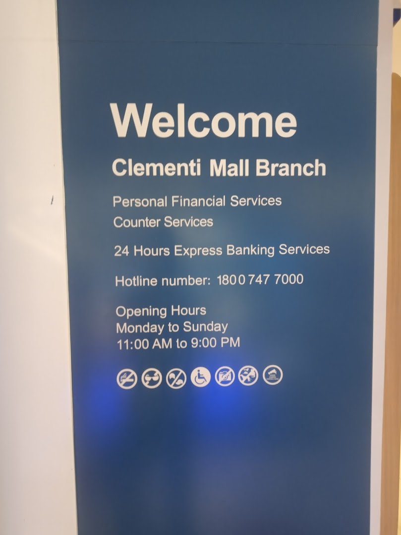 An informational sign for Standard Chartered Bank's Clementi Mall Branch, detailing services and operating hours.