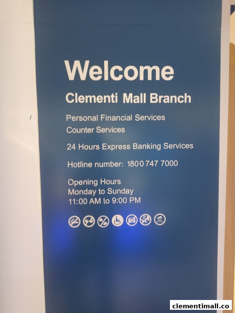 An informational sign for Standard Chartered Bank's Clementi Mall Branch, detailing services and operating hours.