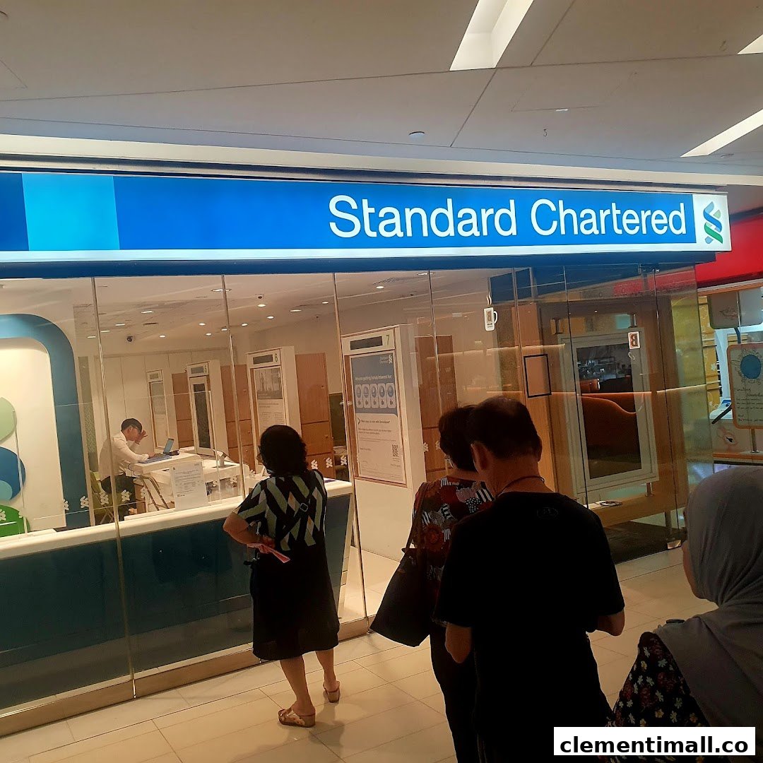 Customers queue outside Standard Chartered Bank at The Clementi Mall.
