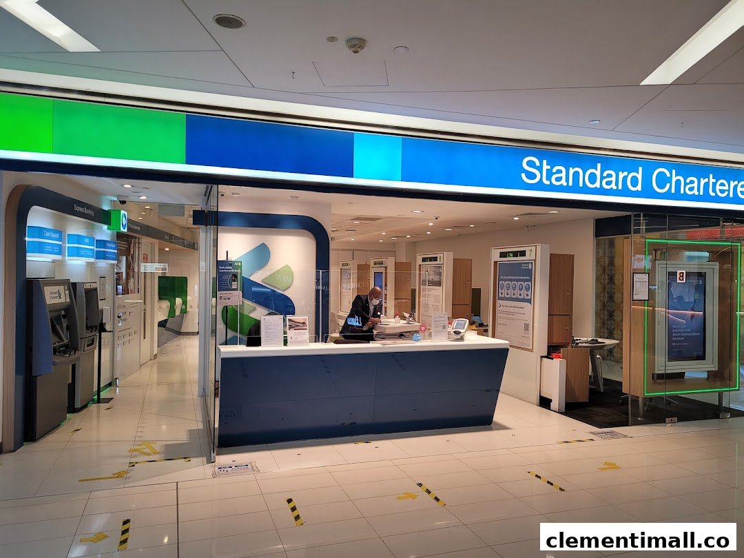The entrance of Standard Chartered Bank at The Clementi Mall, featuring a service counter and ATMs.