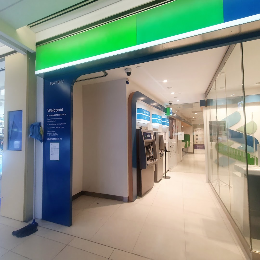Entrance of Standard Chartered Bank at Clementi Mall, featuring ATMs and a welcome sign.