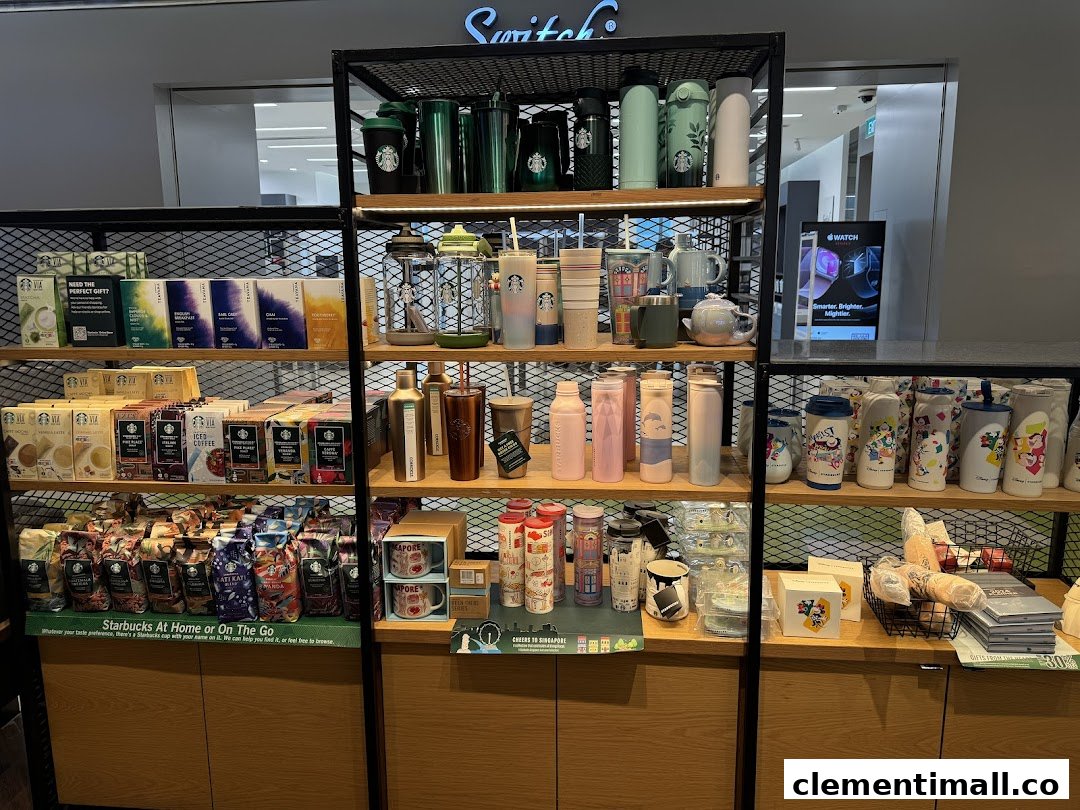 An interior shot of Starbucks displaying various coffee beans, instant coffee, tea, and branded merchandise.