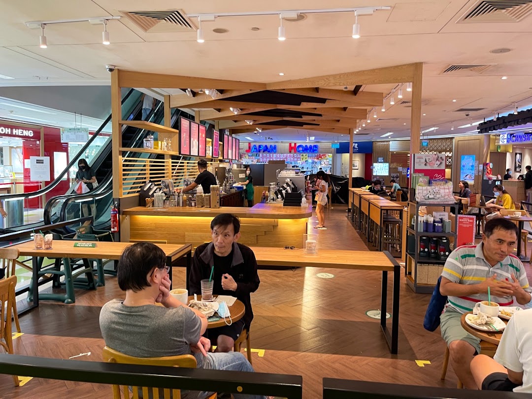 Interior view of Starbucks Clementi Mall with customers enjoying drinks and the bustling mall environment.