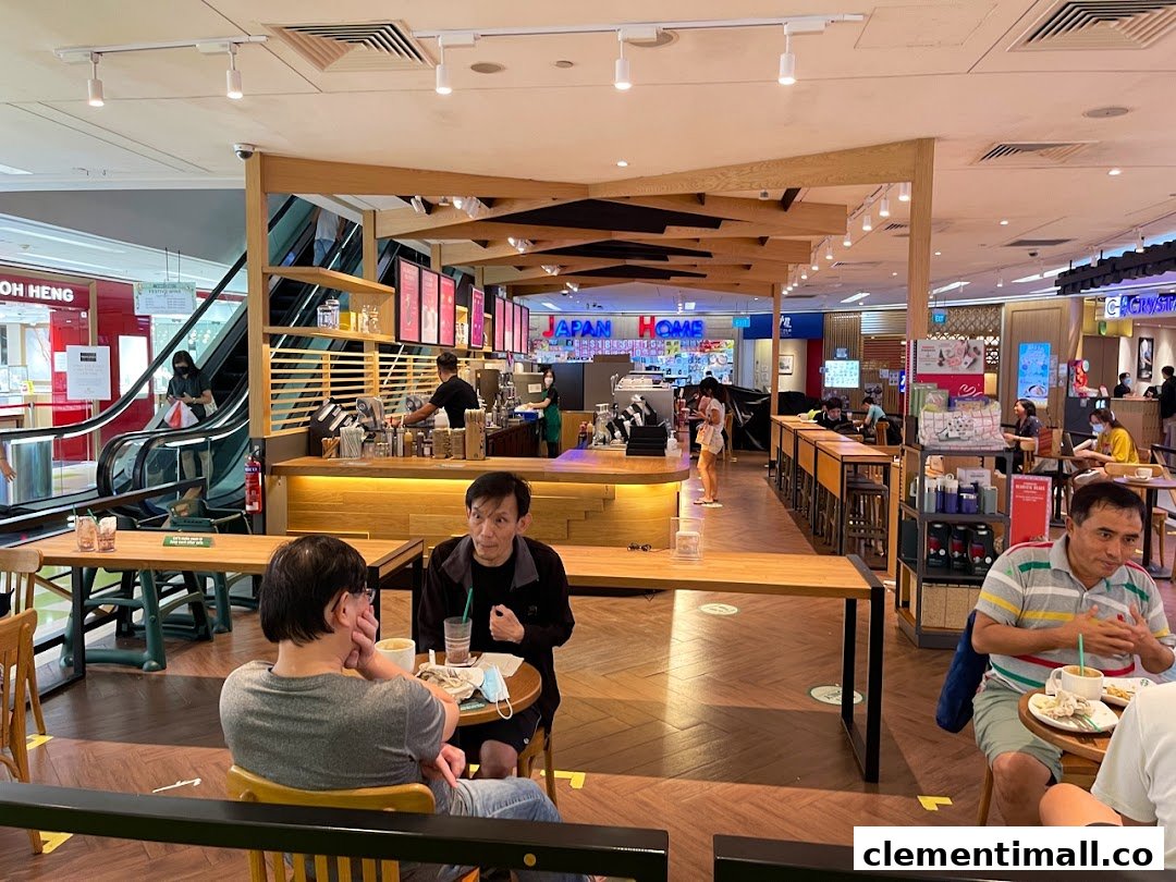 Interior view of Starbucks Clementi Mall with customers enjoying drinks and the bustling mall environment.