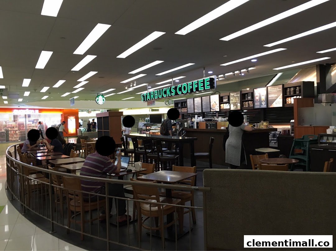 An interior view of Starbucks Clementi Mall with customers enjoying coffee and the cozy ambiance.