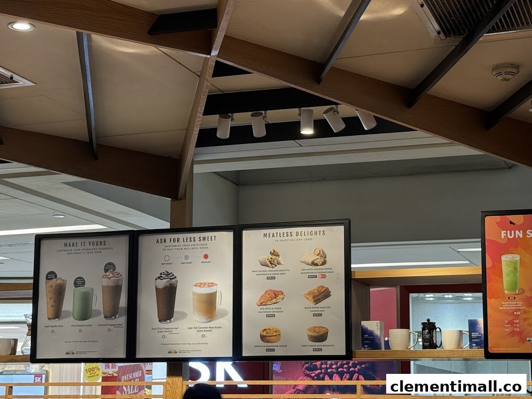 Close-up view of Starbucks menu boards showcasing customizable drinks and meatless food options.