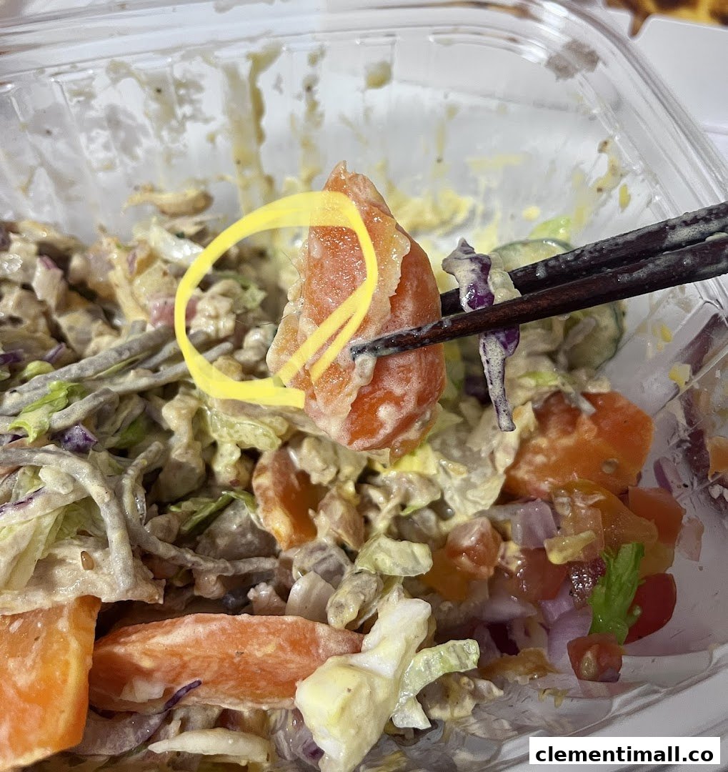 Close-up of a fresh, vibrant salad or bowl from Stuffd, featuring various ingredients and dressing.