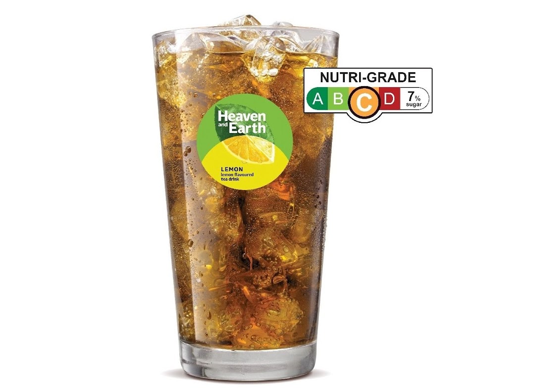 A glass of iced lemon tea with a 'Heaven and Earth' label and 'Nutri-Grade' rating.
