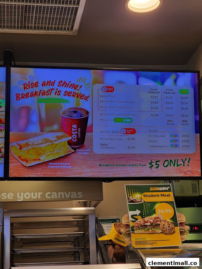 A digital menu board displaying Subway's breakfast options, drinks, and special offers.