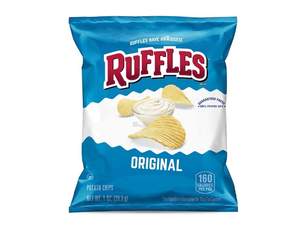 A blue bag of Ruffles Original potato chips featuring ridged chips and a bowl of dip.