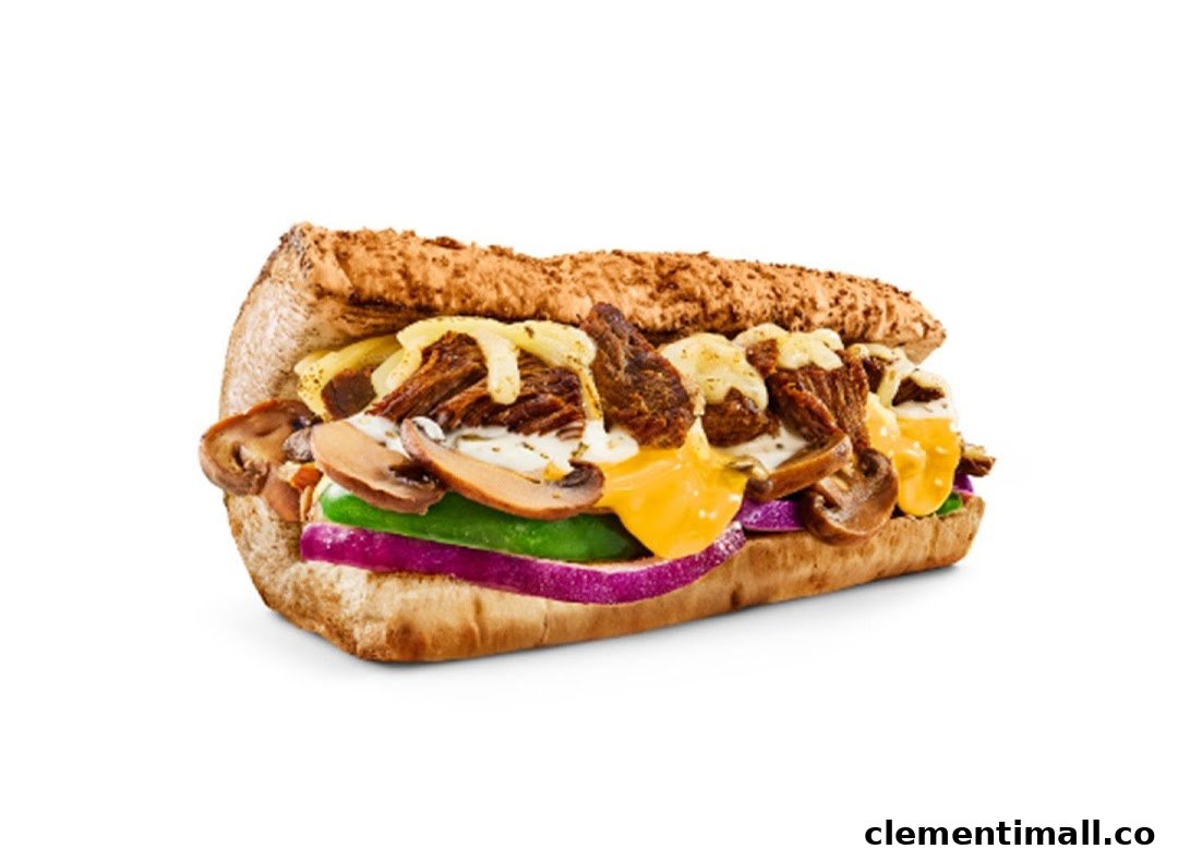 A close-up of a delicious Subway sandwich filled with meat, melted cheese, mushrooms, and fresh vegetables.