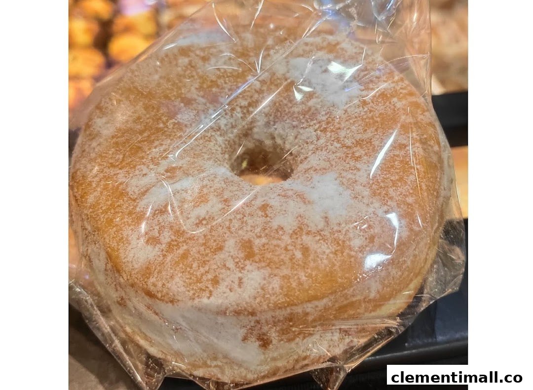 A sugar-dusted donut, individually wrapped, from Swee Heng 1989 Classic.