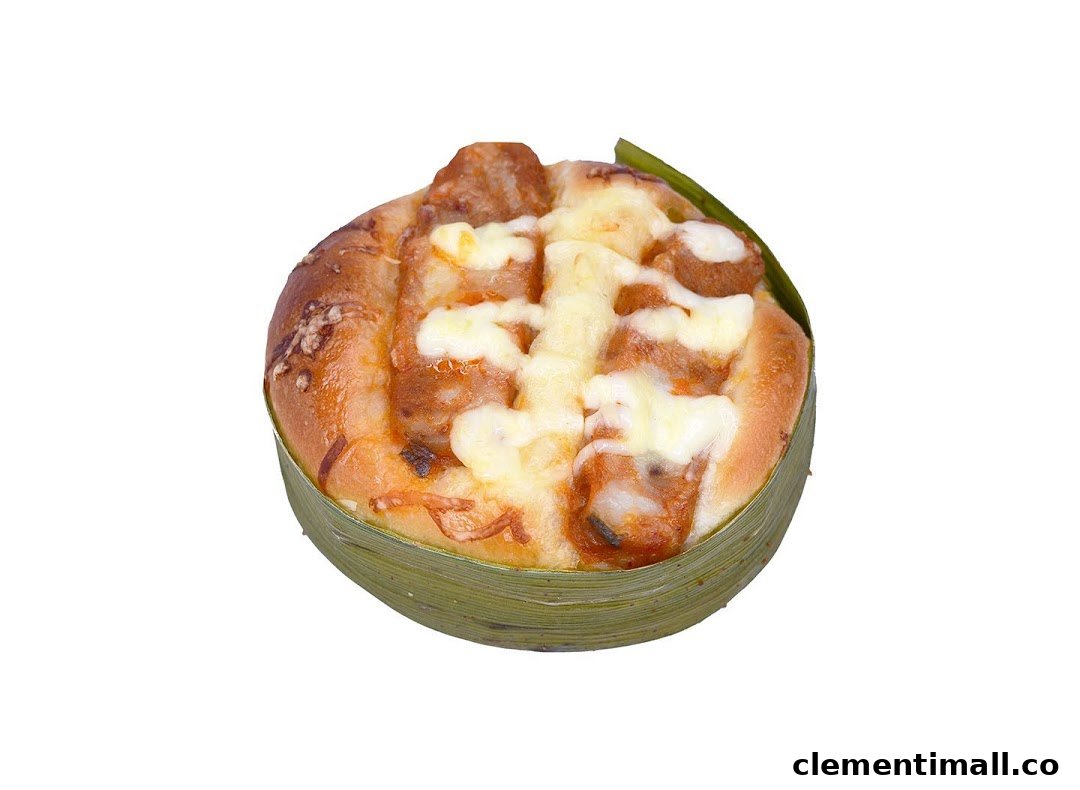 A delicious sausage and cheese bun, wrapped in a banana leaf, from Swee Heng 1989 Classic.