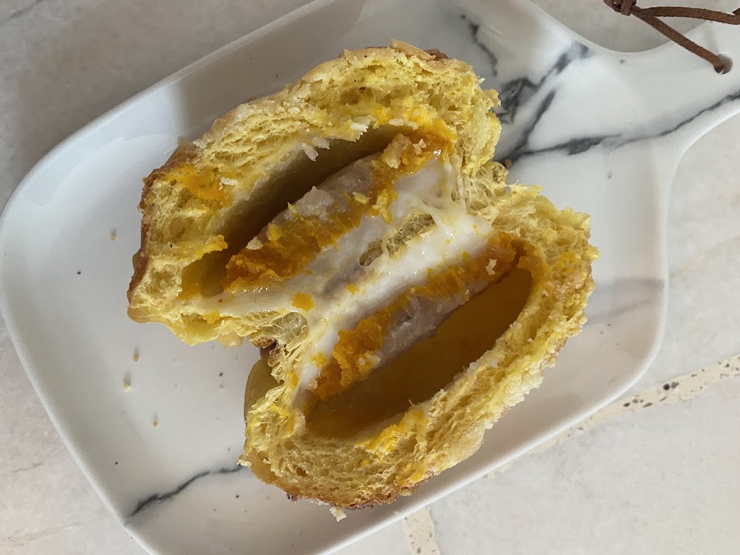 A close-up of a delicious pastry from Swee Heng 1989 Classic, revealing its rich, multi-layered filling.