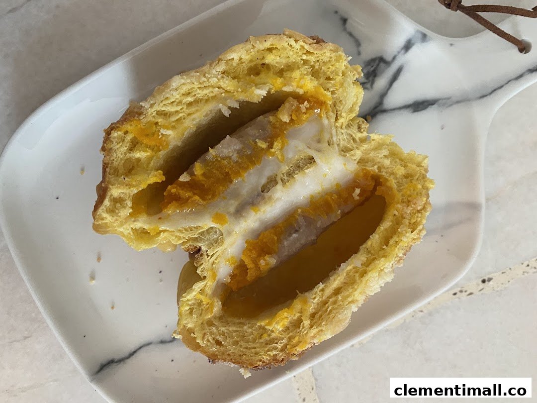 A close-up of a delicious pastry from Swee Heng 1989 Classic, revealing its rich, multi-layered filling.