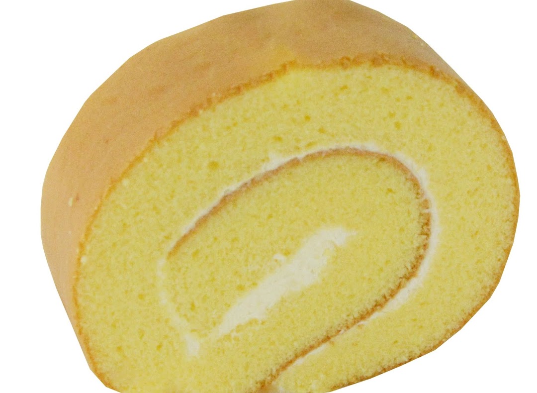 A close-up of a classic vanilla Swiss roll with creamy white filling.