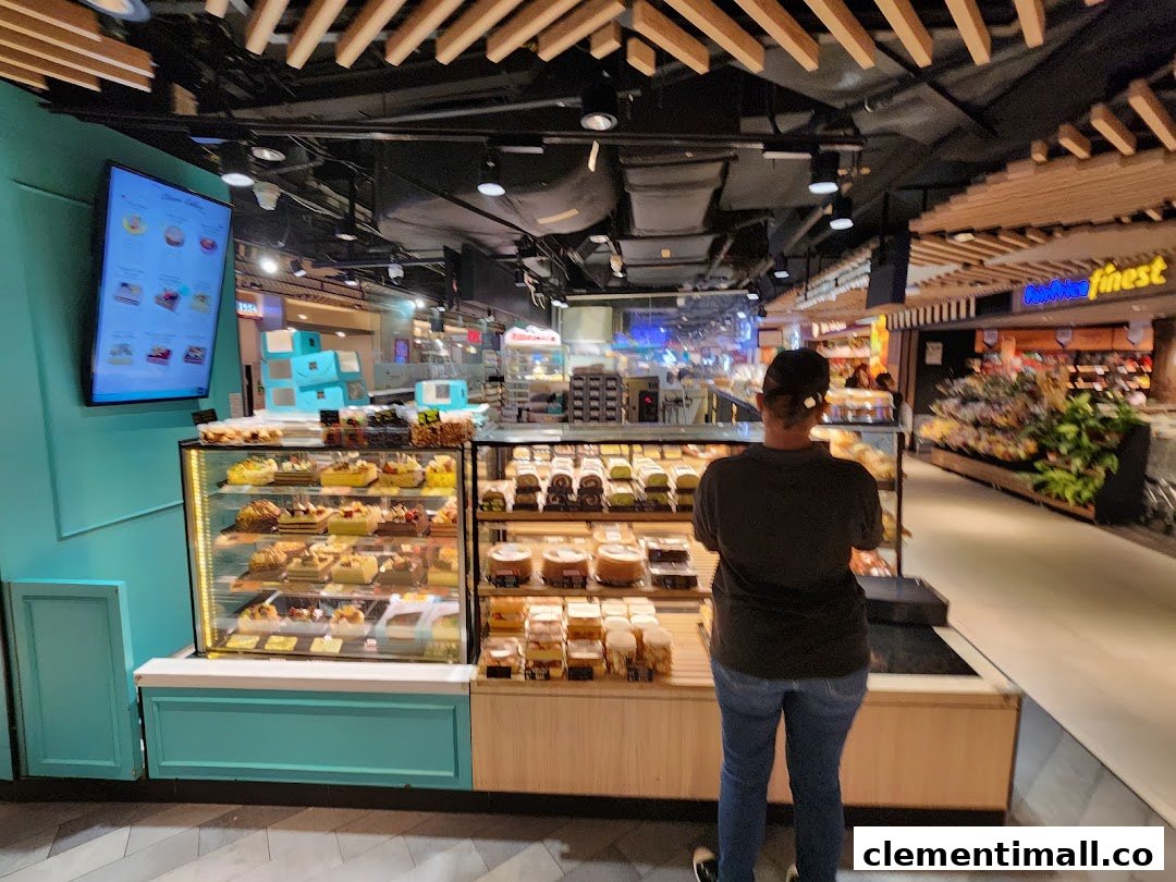 A vibrant bakery counter at Swee Heng 1989 Classic, showcasing an array of delicious cakes and pastries.