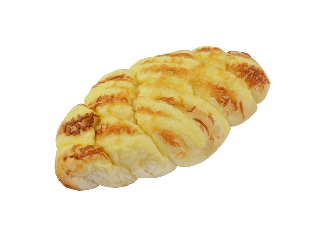 A golden-brown braided bread or bun topped with melted cheese, isolated on a white background.