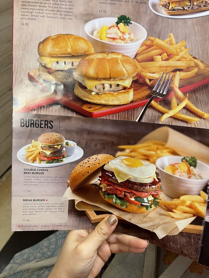 A close-up of Swensen's menu showcasing various burger options with descriptions and prices.